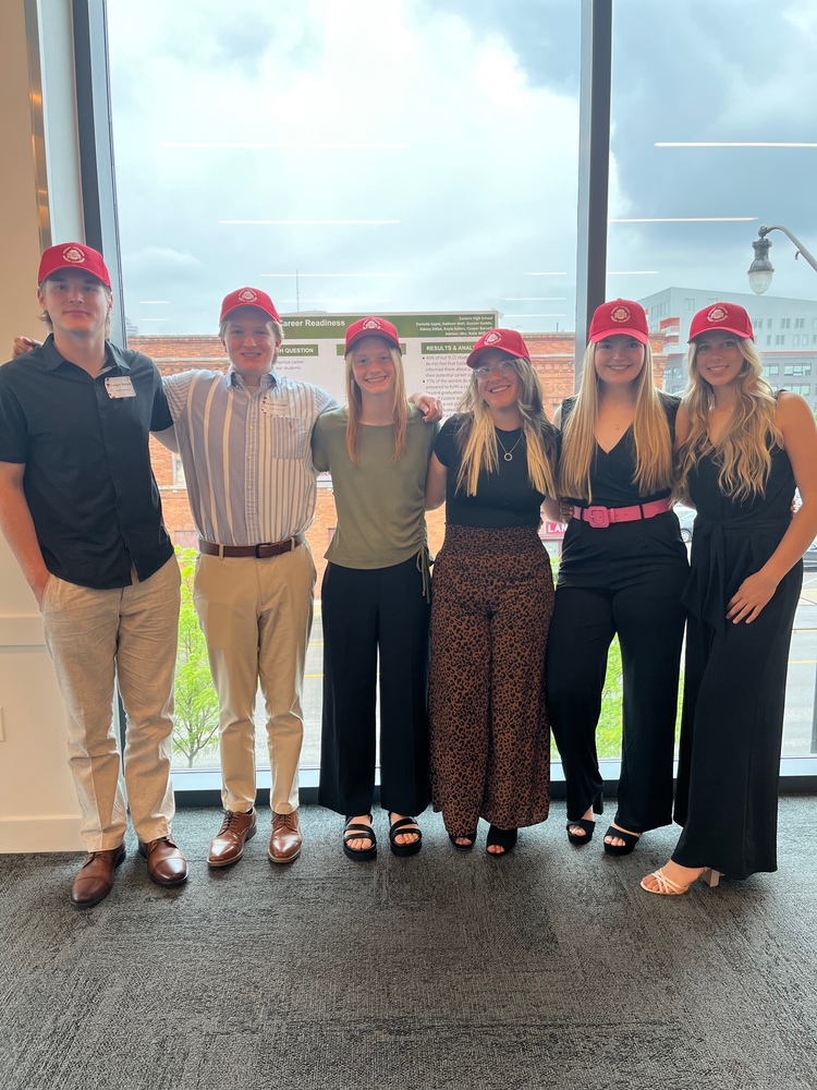 Six Eastern students wear red hats at their OSUSLRC Presentation